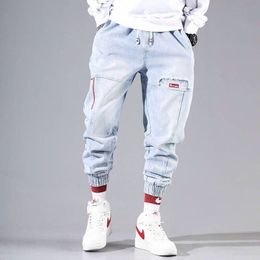 Мужские брюки уличная одежда хип -хоп грузовые джинсы эластичные брюки Харуна бегают осень и зима 230131