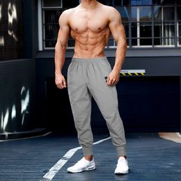 Men's Pants Jogging Men Muscle Fitness Running Training Sports Quick Dry Gym Sweatpants Bodybuilding Casual Trousers 230131