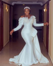 Arabic Aso Ebi Ivory Mermaid Wedding Dresses peplum Lace Pearls Beaded Crystals Sexy long sleeve Bridal Gowns plus size