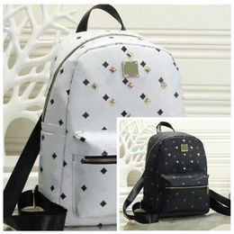 Leather Handbags High Quality 2 size men and women School Backpack famous Rivet printing Backpack Designer lady Bags Boy and Girl 2595