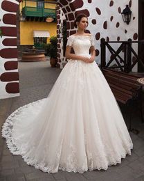 African Dubai Elegant Long A-Line Wedding Dresses Sheer Crew Neck Lace Appliques Beaded Vestios De Novia Bridal Gowns with Buttons Plus Size Beach Wed Dress