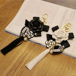 Key Rings Korean Version Of PU Leather Tassel Keychain Camellia Bag Pendant Car Key Ring Mobile Phone Shell Decoration G230210