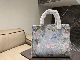 2023 Year of the Tiger Limited Designer Bags Shoulder Bag Famous Lady Large Totes Handbags with features tigers against a colorful pastel-hued backdrop of flowers