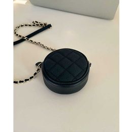 Simple black cowhide small round bag 2023 new soft leather womens design sense messenger 2024