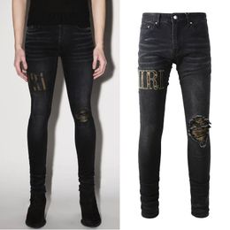 Jeans in denim nero strappato sbattimento danni candeggina lavato usurato vestibilità slim taglia 38