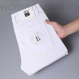 Men's Jeans Designer 2023 new jeans men's light luxury Korean version thin elastic small foot slimming cotton pure white trousers 2ROG