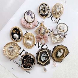 Pins Brooches Retro large camellia crystal chain size 5 pearl tassel brooch women's clothing accessories G230529