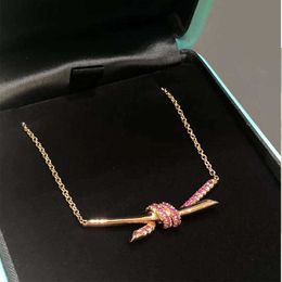 Designer's Brand New Twisted Knot Necklace for Womens Light Luxury Small and Popular Rose Gold Bow Collar Chain High Grade Pink