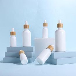 Wholesale White Porcelain Essential Oil Glass Dropper Bottles Empty Serum Bottles 10-100ml With Bamboo Cap Gwriq