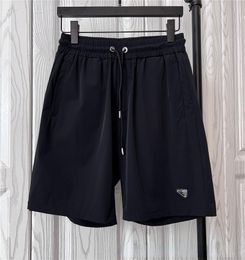 23 New Summer P Triangle Standard Shorts Men Draw Rope Letter Five Quarter Pants Sport Pants Casual Pants