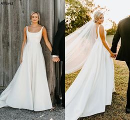 Ein schlichtes weißes Brautkleid mit Satinlinie und Trägern, quadratischer Ausschnitt, ärmellos, rustikale Boho-Land-Brautkleider in Übergröße, niedrige, rückenfreie Empfangsroben von De Mariee