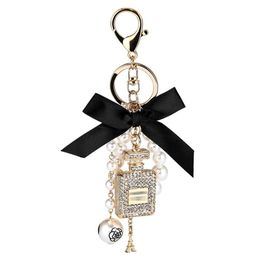 2021 New Imitation Pearl Perfume Bottle Keychain Car Ring Holder Bag Charm Pendant Accessories Bow Key Chain Fashion Keyring4139871986