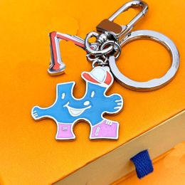 Cartoon keychains Luxury Designer Couple keyring Spring 23 New Puzzle Logo Bag Hanging Decoration Key Chain For Women Men superka