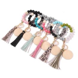 Keychains Womens Keyrings Wood Blank Disc Wristlet Key Ring Holder Silicone Bead Tassel Bracelet Bangle Keychain2529207A3452968262i