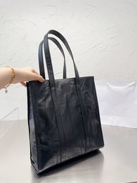 Explosive shopping bag curved design sense open leather handbag strong and light classic triangle logo pattern