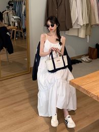 Basic Casual Dresses First Love Tea Break Gentle Wind French White Suspender Dress Female Spring and Summer Small People Show Thin Long Skirt 230619