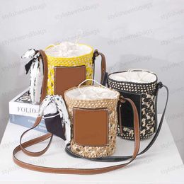 Designer Bags Small Cylinder bag French Lazy Shoulder Art Bucket Straw Beach Vacation Woven Bag Fashion Women's Round Hollow Straw Bag ID stylisheendibags