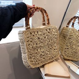 Factory wholesale ladies shoulder bags 2 colors sweet hollow crocheted handbag summer vacation beach travel woven beach bag personalized straw handbags