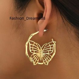 Yingtong Fashion Gold Alloy Hollowed Butterfly Hoop Earrings Women C-shape Bamboo Earrings Jewellery 2023