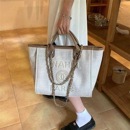 Spring and Summer Bags for Women 2023 New Pearl Small Commuter Handheld Tote Bag Large Capacity Fashion One Shoulder Women's Bag 50% Clearance sale