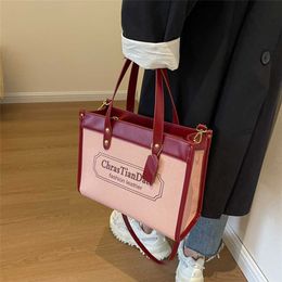 Large capacity letter printed canvas tote 2023 trendy fashion splicing texture practical one shoulder women's bag model 7569