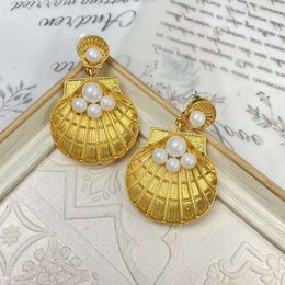 Small group of ancient vintage gold plated shell pearl earrings marked in 'Gravel into Pearl'