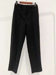 Toteme black wool twill fabric with fine pleated seams for high waisted suit pants