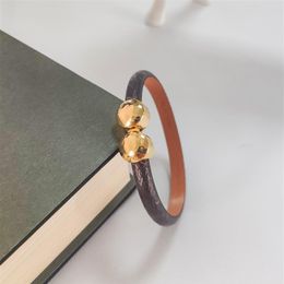 Luxury Jewelry Feminine Leather Designer Bracelet with Gold Heart Brand logo on a high end elegant fashion bracelet with a233i
