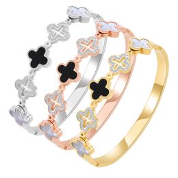 Designer Jewelry Ladies Bracelet 18K Gold-plated Luxury Clover Stainless Steel Jewelry Black and White Shell Diamond Buckle Charm Bracelet Wholesale.