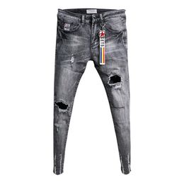 Whole Fashion Casual teenagers cowboy Korean trendy knee ripped hole skinny jeans mens raw edge fashion stretch pants 201111286g