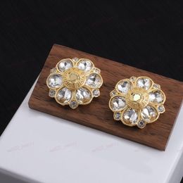 Gold earrings, stylish Zircon crystal flower and engraved portrait interlocking texture designer earrings, Personalised earplugs for weddings, banquets, parties