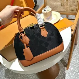 New Luxury Fashion Designer Bag 2023 Pure Steel Gold Hardware accessories Handheld crossbody Bag Shell Bag cowhide edge Aged fabric shell bag