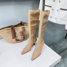 The new minimalist ceiling cat heel over knee elastic boots for autumn and winter, featuring imported elastic Lycra fabric on the upper and sheepskin padding inside