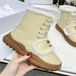 2023-Luxury designer designs popular snow boots with a cold resistant cow patent leather for good warmth retention anti slip and rubber outsole