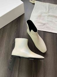 The Row Short Fashionable Sheepskin Flat Sole Boots Unique Triangular Side Opening Design Womens Calf Leather Shoes Clear Soft Leather Patterns