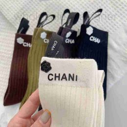 Designer High quality trendy socks hot stamping with three-dimensional letters, medium tube female socks, fashionable camellia logo for wearing on the outside KP1O