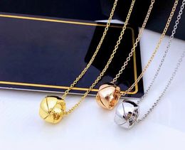 Designer pineapple rhombic plaid, small golden bean mini pendant, niche luxury necklace.