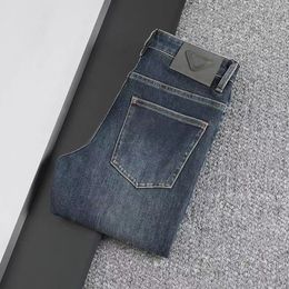 Designer classic men's three-color solid color triangle letter jeans slim stretch straight wash wear resistant top row patch motorcycle vintage business pants