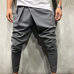 Pantaloni lunghi casuali irregolari da uomo Pantaloni slim da palestra Nuovi pantaloni da corsa solidi Pantaloni da palestra con coulisse Pantaloni sportivi lunghi283V