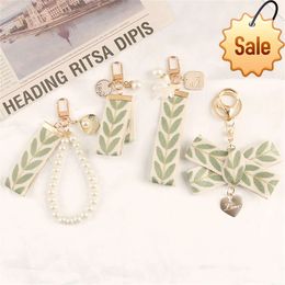 Fashion Fresh Leaf Stripe Key Ring Embroidery Alloy Pearl Pendant Heart Charm Keychain Women Bag Car Ornament Couple Gift