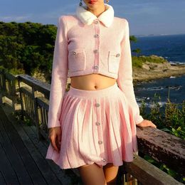 Designer two-piece set with detachable plush collar and diamond embellishments, pink knitted short jacket and skirt set