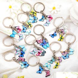 Party Favour New Style Key Chain Colorf Butterfly Bag Charm Cell Phone Accessory Preppy Schoolbag Pendant Home Garden Festive Party Sup Dhklf