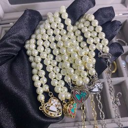 Western Empress Dowager's Classic Saturn Pearl Necklace Small and High Class Design Sense Love Dropping Oil Enamel Collar Chain Accessories