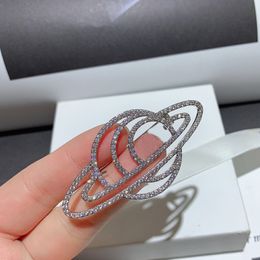 Fashion copper bottom micro embedded rhinestone saturn brooches for ladies Favourite badges clothing pins accessories in European and American countries