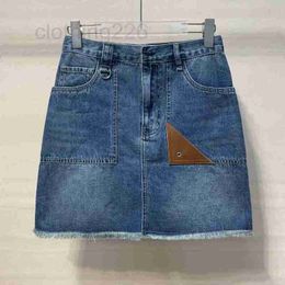 Skirts Designer High Quality 2023 Summer and Autumn New Denim Short Skirt Front Pocket Small Corner Leather High end Fashion Versatile Pants KN4W