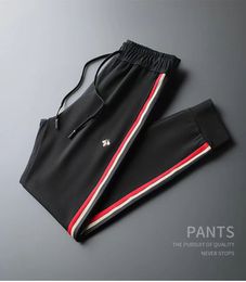 Men's Pants Designer High-end mens sweatpants designer pants autumn lace-up foot protection slacks men women side striped jacquard trousers