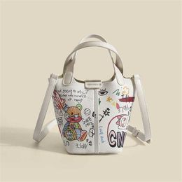 Shoulder Bags New Women designer bag Cute Versatile Little Bear Graffiti Bucket Simple Vegetable Basket Portable Steamed Bun Mother Crossbody 230323