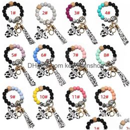 Party Favour Sile Cursive Cow Bead Bracelet Wood Disc Keychain Tassel Ox Head Wrist Key Ring Charm Pendant Accessory Wholesale Drop Del Dhcym