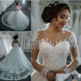 A-Line Wedding Dresses Sexy See Through Long Sleeve Ivory Sheer Bling Beaded Lace Applique Jewel Neck Ball Gowns Chapel Bridal Drop Dhlvd