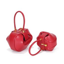 Elegant Evening Bag: Vintage Dumpling Design | Metallic Accents | Genuine Leather | Trendsetting & Versatile red brown